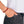 vue porté au poignet par mannequin, vue zoom, gros plan, en entier, bracelet boho les fleurettes, couleur lithci/orange/terracotta/rouille. Silicone souple, bijoux fantaisies, ladygum, marque française. Bracelet aux fleurs en relief, non ajustable, taille unique, facile à enfiler au poignet. Cadeau original.
