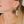 zoom, vue gros plan, paire de boucles d'oreilles rose, couleur noir. Portées par mannequin Dorine Gaudin. Bijoux fantaisies en silicone, marque française, créateurs, designers. Style fleur, floral, nature, amour, pétale. Attache dormeuse en acier inoxydable. Minimisant les allergies, résistant à l'eau/à la chaleur/à la lumière, souple, léger. Cadeau original.