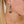 zoom, vue gros plan, paire de boucles d'oreilles dentelle, couleur noir. Portées par mannequin Dorine Gaudin. Bijoux fantaisies en silicone, marque française, créateurs, designers. Style pendante, géométrique, graphique, féminin, minimaliste, motif. Attache dormeuse en acier inoxydable. Minimisant les allergies, résistant à l'eau/à la chaleur/à la lumière, souple, léger. Cadeau original.