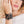 zoom, vue gros plan, bracelet hippie, couleur noir. Vue taille réelle, porté sur poignet par mannequin Dorine Gaudin. Bijoux fantaisies en silicone, ladygum, marque française, créateurs, designers. Style manchette femme, nature, fleur, floral, paquerette, marguerite, année 70. Léger, souple, longueur réglable, bracelet ajustable, fermoir en T, résistant à l'eau, à la chaleur, à la lumière, minimisant les allergies. Cadeau original.