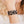 zoom, vue gros plan, bracelet tétris, couleur noir. Vue taille réelle, porté sur poignet par mannequin Dorine Gaudin. Bijoux fantaisies en silicone, ladygum, marque française, créateurs, designers. Style manchette femme, carré, cube, géométrique, contemporain. Léger, souple, longueur réglable, bracelet ajustable, fermoir en T, résistant à l'eau, à la chaleur, à la lumière, minimisant les allergies. Cadeau original.