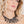 zoom, vue gros plan, collier corail, couleur noir, dispo en rouge/corail. Vue taille réelle, porté par mannequin dorine gaudin. Bijoux fantaisies en silicone, ladygum, marque française, créateurs, designers. Style plastron, algues, mer, plante, feuille, nature. Léger, souple, résistant à l'eau/à la chaleur/à la lumière. Collier ajustable, longueur réglable, fermoir en T. Cadeau original.