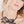 zoom, vue gros plan, collier vague à l'âme, couleur noir. Vue taille réelle, porté par mannequin dorine gaudin. Bijoux fantaisies en silicone, ladygum, marque française, créateurs, designers. Style plastron, fleur, feuilles, plante, nature, floral, flamme, plume, grand, large. Léger, souple, résistant à l'eau/à la chaleur/à la lumière. Collier ajustable, longueur réglable, fermoir en T. Cadeau original.