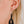 zoom, vue gros plan, paire de boucles d'oreilles clochette, couleur noir. Portées par mannequin Dorine Gaudin. Bijoux fantaisies en silicone, marque française, créateurs, designers. Style nature, fleur, floral, pendante, courte, feuille. Attache dormeuse en acier inoxydable. Minimisant les allergies, résistant à l'eau/à la chaleur/à la lumière, souple, léger. Cadeau original.