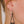 zoom, vue gros plan, paire de boucles d'oreilles dentelle, couleur noir. Portées par mannequin Dorine Gaudin. Bijoux fantaisies en silicone, marque française, créateurs, designers. Style pendante, géométrique, graphique, féminin, minimaliste, motif. Attache dormeuse en acier inoxydable. Minimisant les allergies, résistant à l'eau/à la chaleur/à la lumière, souple, léger. Cadeau original.