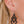 zoom, vue gros plan, paire de boucles d'oreilles diamant, couleur noir. Portées par mannequin Dorine Guadin. Bijoux fantaisies en silicone, marque française, créateurs, designers. Style losange, triangle, géométrique, graphique, moderne, contemporain. Attache dormeuse en acier inoxydable. Minimisant les allergies, résistant à l'eau/à la chaleur/à la lumière, souple, léger. Cadeau original.