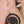 zoom, vue gros plan, paire de boucles d'oreilles triptic, couleur noir. Portées par mannequin Dorine Gaudin. Bijoux fantaisies en silicone, marque française, créateurs, designers. Style créole, lune, étoile, croissant, cercle, rond, lunaire, astronomie. Attache dormeuse en acier inoxydable. Minimisant les allergies, résistant à l'eau/à la chaleur/à la lumière, souple, léger. Cadeau original.
